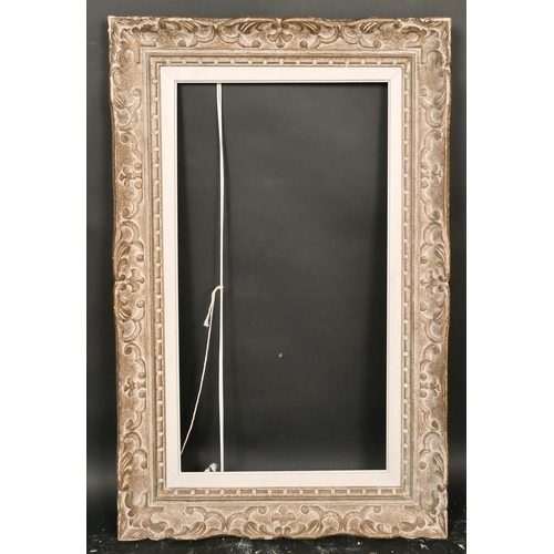 33 - An early 20th century carved wood frame, rebate size 14