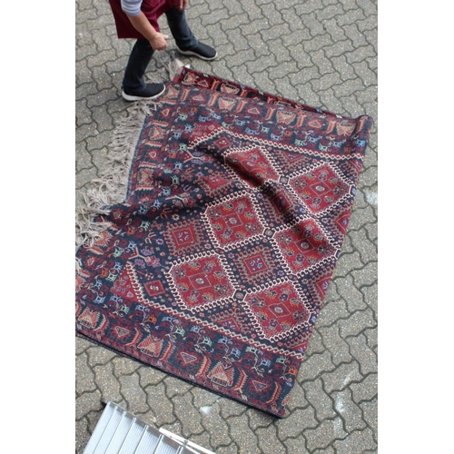 1010 - A LARGE PERSIAN CARPET with twenty main medallions 10ft long x 6ft 6ins wide.