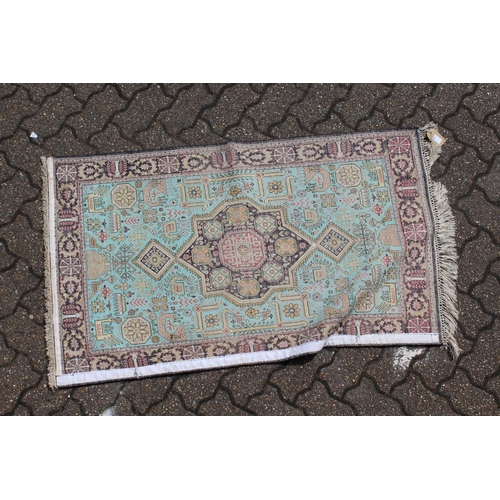 1014 - A SMALL PERSIAN PART SILK RUG. 4ft 4ins x 2ft 7ins.
