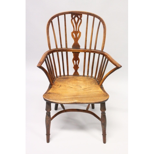 1026 - AN 18TH CENTURY YEW WOOD WINDSOR ARMCHAIR with crinoline stretcher.