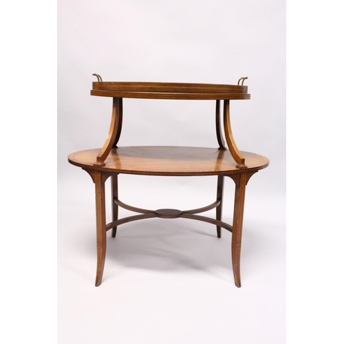 1029 - A GOOD MAHOGANY OVAL TWO TIER TABLE with detatchable  two handled glass tray on curving support with... 