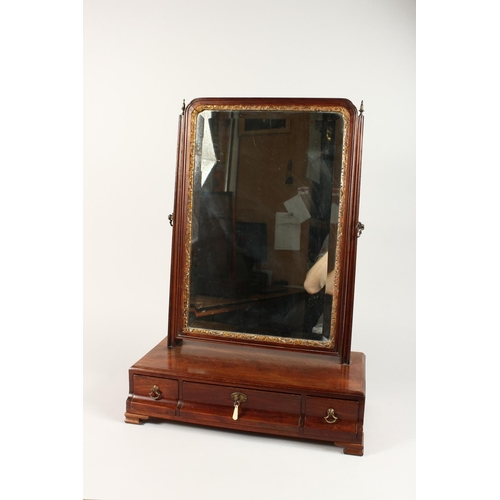 1033 - A GEORGIAN MAHOGANY TOILET MIRROR, gilded glass mirror, the base with three drawers on bracket feet.