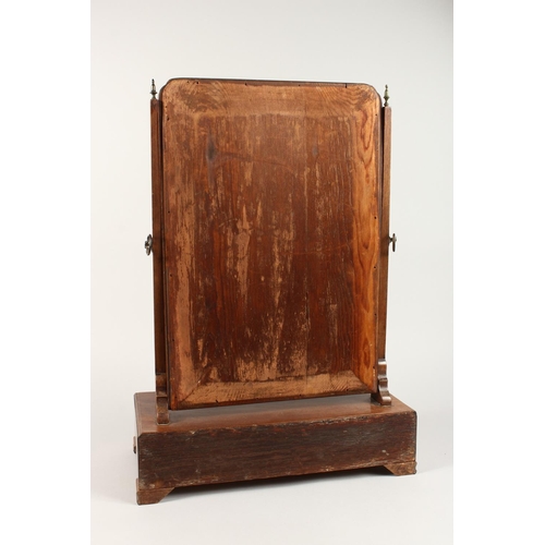 1033 - A GEORGIAN MAHOGANY TOILET MIRROR, gilded glass mirror, the base with three drawers on bracket feet.