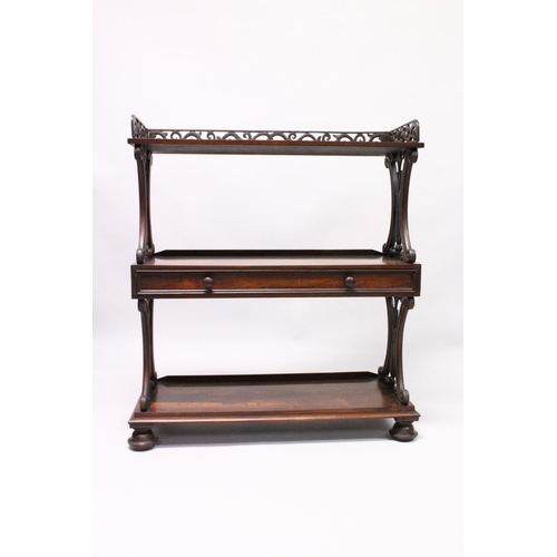 1034 - A GOOD LATE REGENCY ROSEWOOD THREE TIER WHAT-NOT, with pierced gallery, three shelves, the centre on... 