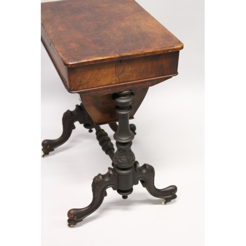 1040 - A GOOD VICTORIAN FIGURED WALNUT SEWING TABLE with single drawer, walnut sewing bag, carved and turne... 