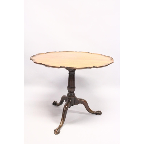 1049 - A CHIPPENDALE STYLE MAHOGANY TILT TOP TABLE with pie crust top, turned support, curving legs with cl... 