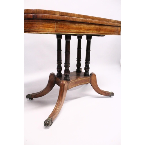 1050 - A MAHOGANY ROSEWOOD BRASS INLAID TILT SWIVEL TOP CARD TABLE, with green baize cover, four tuned supp... 