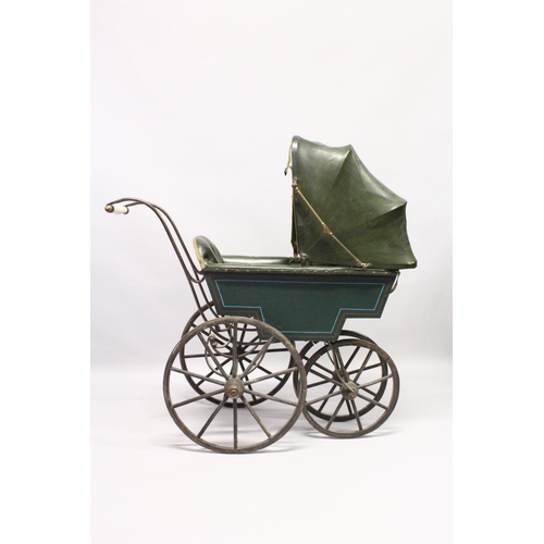 1051 - A RARE VICTORIAN METAL, WOOD AND LEATHER PRAM with folding hood, porcelain handles, wooden wheels. 3... 