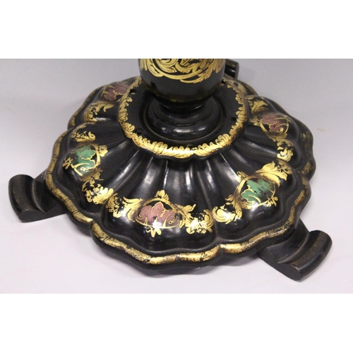 1053 - A VICTORIAN BLACK AND GILT PAPIER MACHE TILT TOP GAMES TABLE, with inlaid chess board in mother of p... 