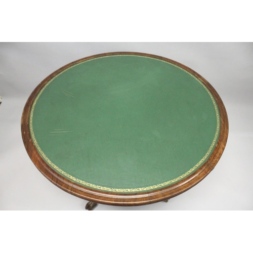 1056 - A REGENCY MAHOGANY CIRCULAR TABLE, with inset leather top with four curving rams masks on hoof feet.... 