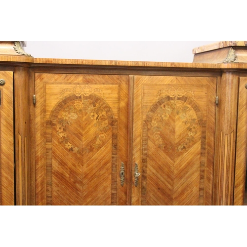 1060 - A GOOD LARGE FRENCH KINGWOOD CABINET, formed as a pair of central marquetry panel doors, over a brus... 