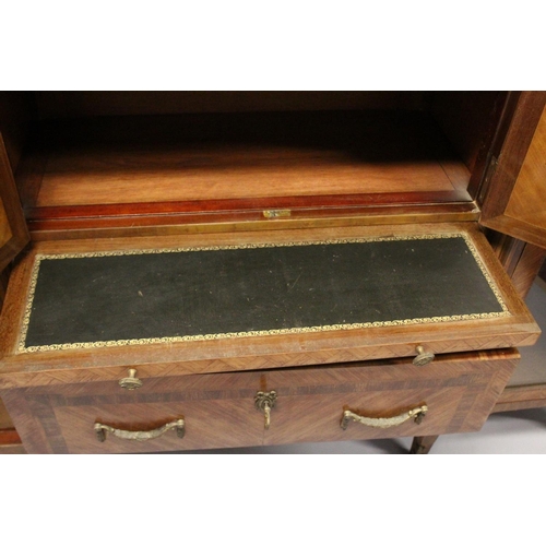 1060 - A GOOD LARGE FRENCH KINGWOOD CABINET, formed as a pair of central marquetry panel doors, over a brus... 