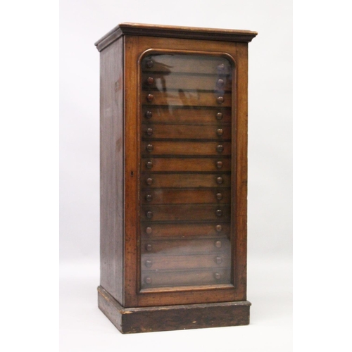 1061 - A VERY GOOD VICTORIAN MAHOGANY COLLECTORS CABINET, with glass front door enclosing 14 glass top draw... 