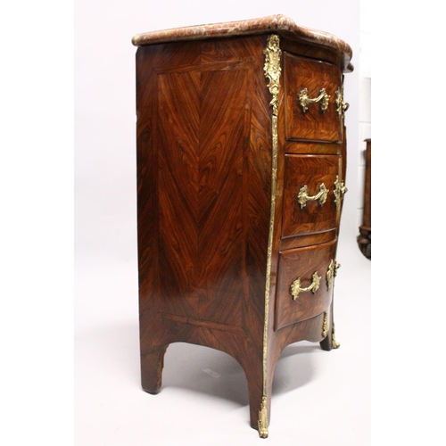 1089 - A LOUIS XV SERPENTINE-FRONTED KINGWOOD PETIT COMMODE with marble top, three drawers with brass handl... 