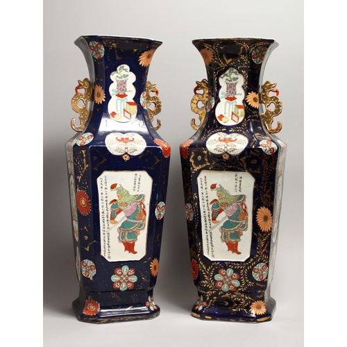 1186 - A LARGE PAIR OF IRONSTONE JAPAN PATTERN TWO HANDLED VASES with Chinese panels. 23ins high.