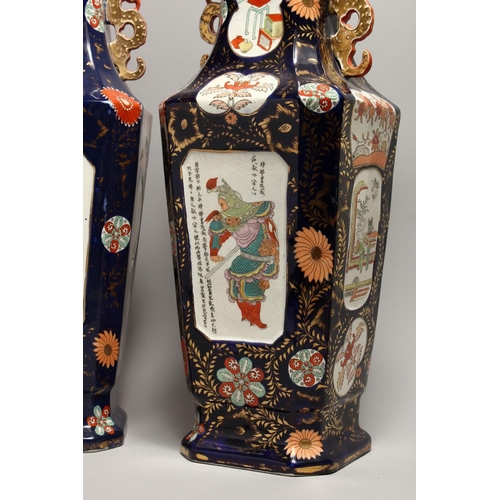 1186 - A LARGE PAIR OF IRONSTONE JAPAN PATTERN TWO HANDLED VASES with Chinese panels. 23ins high.