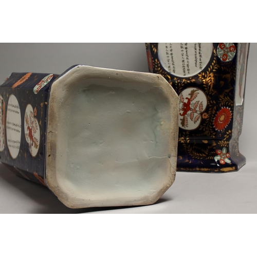 1186 - A LARGE PAIR OF IRONSTONE JAPAN PATTERN TWO HANDLED VASES with Chinese panels. 23ins high.