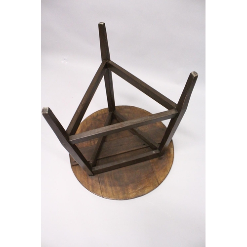 1056 - AN 18TH CENTURY STYLE CRICKET TABLE , the circular top supported on three square legs united by stre... 