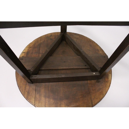 1056 - AN 18TH CENTURY STYLE CRICKET TABLE , the circular top supported on three square legs united by stre... 