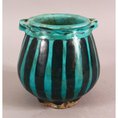 A SMALL RAQQA WARE POSSIBLY 14TH CENTURY TURQUOISE POT, 10cm high ...