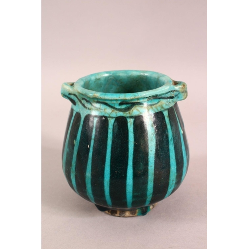 A SMALL RAQQA WARE POSSIBLY 14TH CENTURY TURQUOISE POT, 10cm high ...
