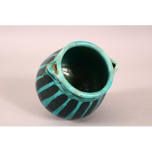 A SMALL RAQQA WARE POSSIBLY 14TH CENTURY TURQUOISE POT, 10cm high ...