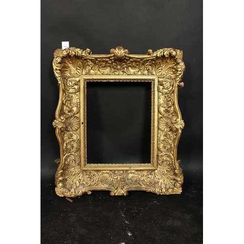 1001 - A 19th century carved wood frame with locking inner front ornament, rebate size 12  x 16 , 31cm x 40... 