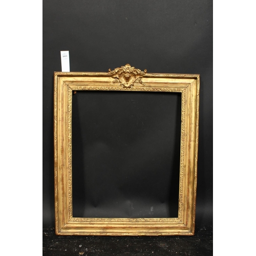 1011 - An early 20th century gilt composition frame with central cartouche, rebate size 19.75  x 16.5 , 50c... 