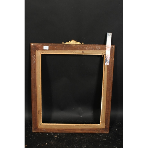 1011 - An early 20th century gilt composition frame with central cartouche, rebate size 19.75  x 16.5 , 50c... 
