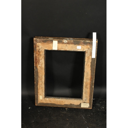 1017 - A 19th century gilt composition frame with moulded and ribbon tied top ornament, rebate size 13  x 1... 