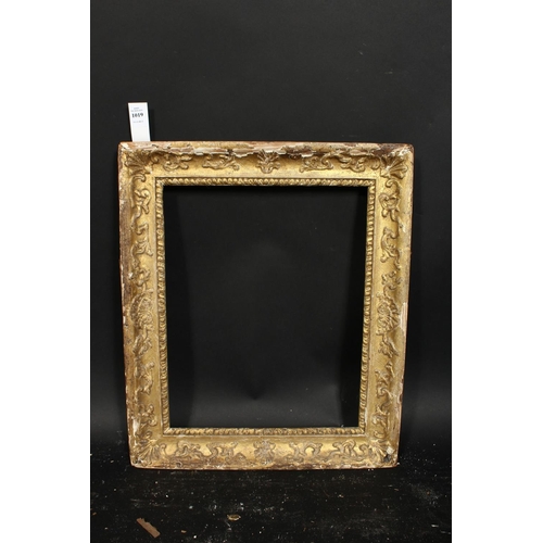 1019 - An early gilt composition frame with moulded inner ornament, wide rebate 16  x 13 , 40.5cm x 33cm.