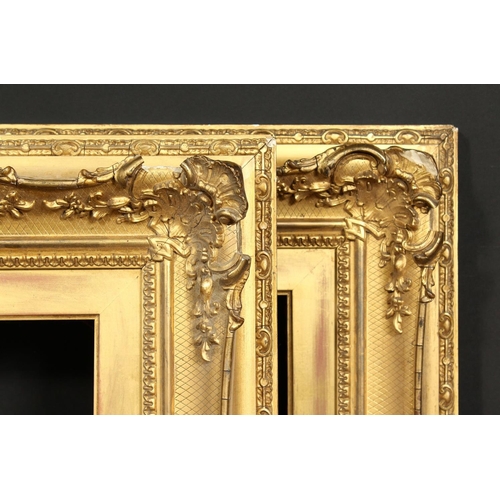 1021 - A pair of 19th century gilt composition swept frames, rebate size each 10  x 20 , 25.5cm x 51cm.