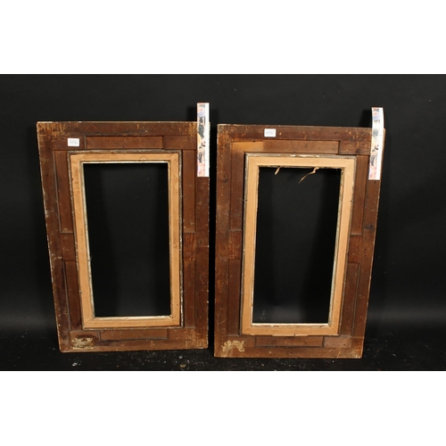 1021 - A pair of 19th century gilt composition swept frames, rebate size each 10  x 20 , 25.5cm x 51cm.