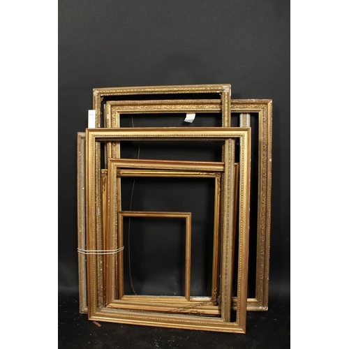 1026 - A group of eight moulded and composition frames of various designs, sizes from 21.5  x 29.5  to 10  ... 
