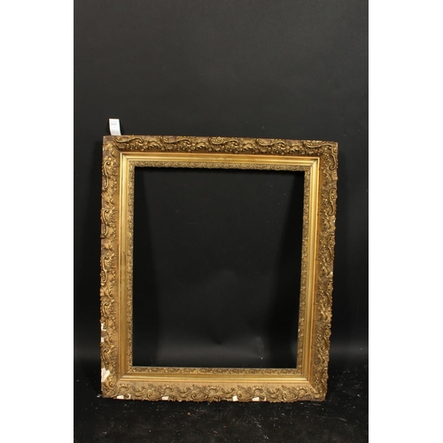 1029 - A 19th century continental gilt composition frame, rebate size 21.5  x 25.5 , 55cm x 65cm.