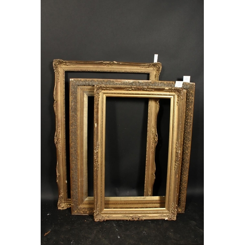 1033 - A group of three 19th century and later gilt composition frames, rebate sizes 25  x 30 , 63.5cm x 76... 
