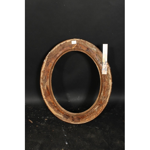 1041 - A 19th century oval frame with flowered cartouches and incised scrolling, rebate size 19.25  x 15 , ... 