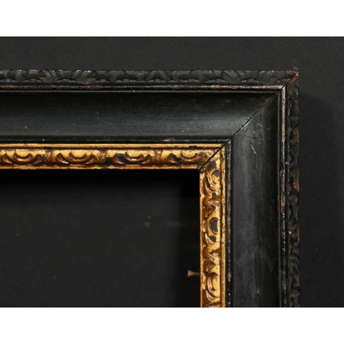 1052 - An 18th century carved and ebonised frame with a gilded inner ornament, rebate size 16  x 20.25