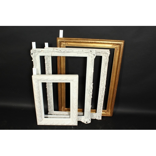 1056 - A group of four early 20th century frames of various styles, rebate size 12.75  x 19 , 32cm x 48cm, ... 