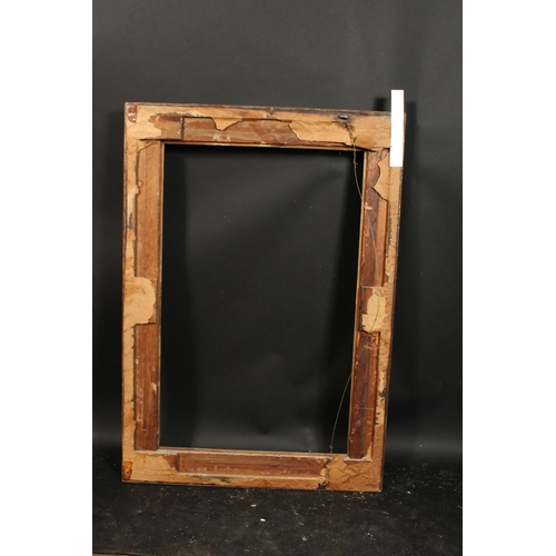 1058 - A 19th century gilt composition swept frame, rebate size 22.5  x 35.5 , 57cm x 90cm.