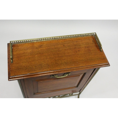 14 - AN EDWARDIAN MAHOGANY RECTANGULAR MAGAZINE RACK with brass gallery, fold down front with three secti... 