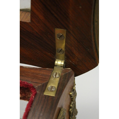 16 - A GOOD 19TH CENTURY FRENCH ROSEWOOD BIJOUTERIE TABLE with ornate mounts, lift-up glazed top, glass s... 