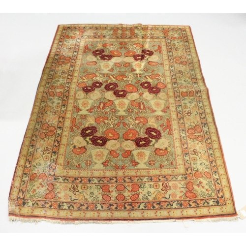 1001 - AN UNUSUAL PERSIAN RUG, beige ground, the central panel with vases of flowers. 5ft 8ins x 3ft 11ins.... 