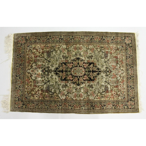 1002 - A  PERSIAN SILK RUG, beige ground with all over floral decoration. 5ft 6ins x 3ft 8ins