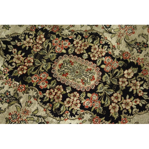 1002 - A  PERSIAN SILK RUG, beige ground with all over floral decoration. 5ft 6ins x 3ft 8ins