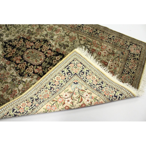 1002 - A  PERSIAN SILK RUG, beige ground with all over floral decoration. 5ft 6ins x 3ft 8ins