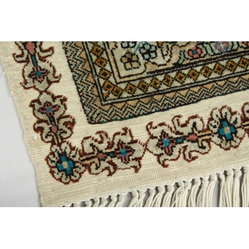 1003 - A SMALL PERSIAN SILK RUG, pale blue ground with fine floral design. 4ft x 2ft 6ins.