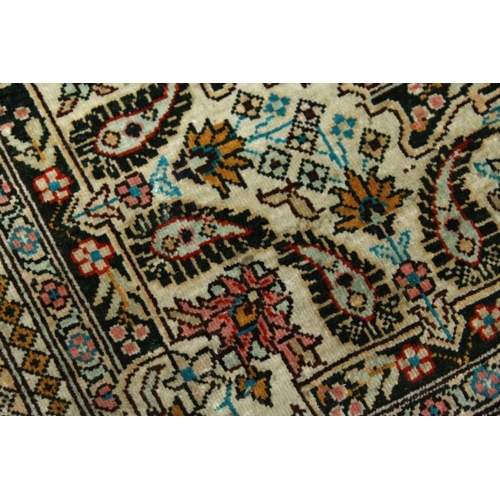 1003 - A SMALL PERSIAN SILK RUG, pale blue ground with fine floral design. 4ft x 2ft 6ins.