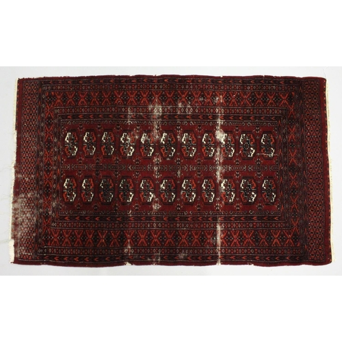 1004 - A BOKHARA RUG, red ground with two rows of eleven gulls (worn). 5ft 4ins x 3ft 2ins.