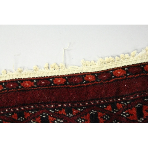 1004 - A BOKHARA RUG, red ground with two rows of eleven gulls (worn). 5ft 4ins x 3ft 2ins.